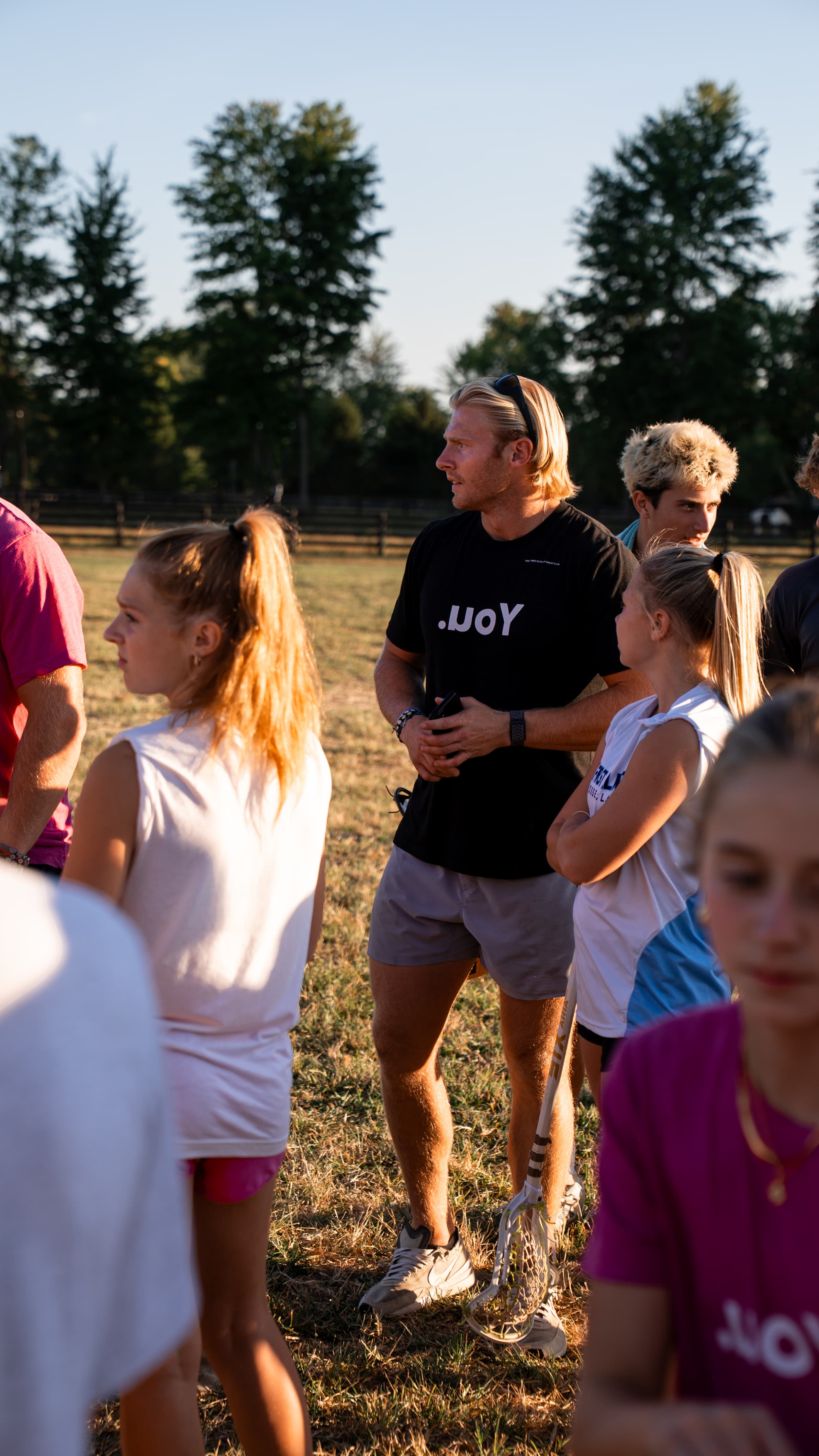 Harrison among young athletes at golden hour